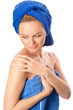 Portrait of young beautiful woman with blue towel after bath