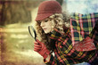 Foto: young woman with magnifier glass and hat young woman with magnifier glass and hat