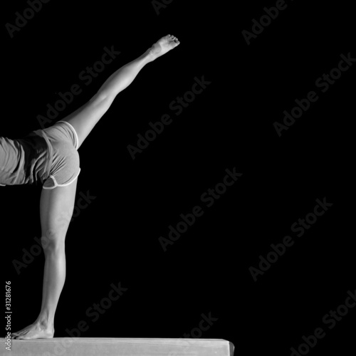 Photo: spread legs of female gymnast on balance beam spread legs of female gymnast on balance beam