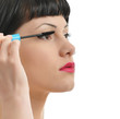 closeup of a pretty girl applying mascara closeup of a pretty girl applying mascara