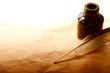 Feather and ink bottle isolated on paper background