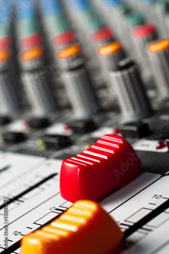 Photo: Big red slider on a sound mixer Big red slider on a sound mixer