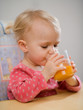 little girl with carrot juice