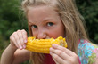 Young Girl Eating Corn