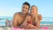 Video: Cute couple lying on a beach Cute couple lying on a beach