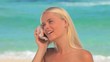  Woman listening to a shell