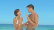 Attractive couple eating water ices