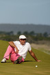 Foto: Golfer resting on the green Golfer resting on the green