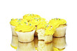 Yellow cupcakes on white