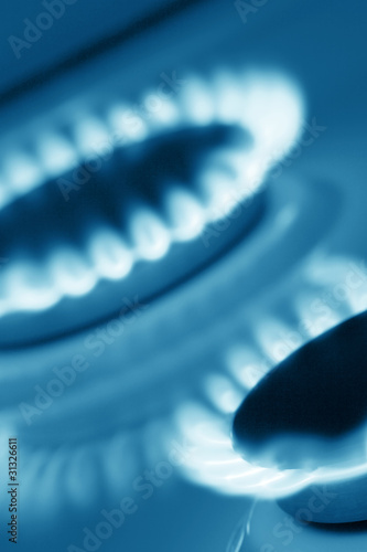Photo: Two burners of cooker (blue toned) Two burners of cooker (blue toned)