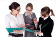 three young and beautiful business women discuss portfolio