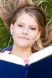Foto: young student with one book in the park young student with one book in the park