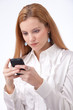 businesswoman typing on smartphone