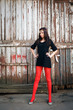 Young beautiful woman against the backdrop of an barn