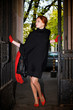 Young beautiful woman next to the gate