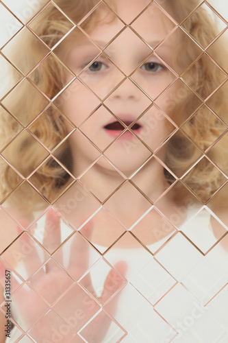 Photo: Autistic Child Blurred Behind Pane Of Glass Autistic Child Blurred Behind Pane Of Glass