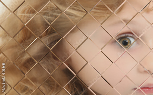 Photo: Autistic Child Blurred Behind Pane Of Glass Autistic Child Blurred Behind Pane Of Glass