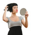 Portrait of a beautiful woman looking at the mirror
