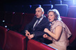 Photo: Couple in movie theater scared watching horror movie Couple in movie theater scared watching horror movie