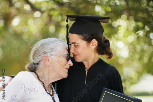 Photo: Happy graduate with grandmother celebrating graduation Happy graduate with grandmother celebrating graduation