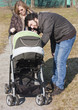 Happy Family Walking with Stroller