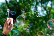 Blowing soap bubbles Blowing soap bubbles