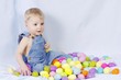 Baby Boy Playing With Color Easter Eggs