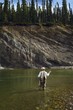 Man Fly Fishing In Mountain River