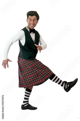 Photo: Expressive man in Scottish costume. Expressive man in Scottish costume.