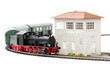 old steam loco model with passenger cars