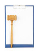 Gavel on clipboard isolated on white