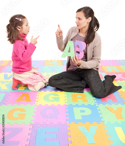 Photo: Girl learning phonics alphabet abc Girl learning phonics alphabet abc