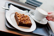 Hazelnut cake and coffee served on cafeteria Hazelnut cake and coffee served on cafeteria