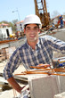 Construction worker standing on building site Construction worker standing on building site