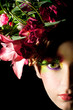 Close up portrait of beautiful woman with creative flower cap.