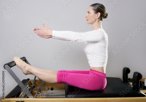 Photo: pilates reformer woman gym fitness teacher legs pilates reformer woman gym fitness teacher legs