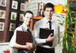 Foto: Waitress girl and waiter man in restaurant Waitress girl and waiter man in restaurant