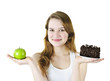 Photo: Young girl holding apple and cake Young girl holding apple and cake
