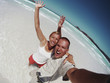 Couple Having Fun On The Beach
