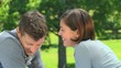 Loving young couple talking outside