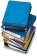 A pile of ring binders and folders isolated