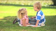 Young boy and his sister talking 