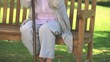 Elderly woman thinking while holding her walking stick
