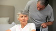 Video: Man talking with his grey-haired wife in a wheelchair Man talking with his grey-haired wife in a wheelchair