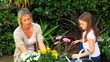 Mother gardening with her daughter