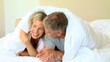 Couple lying in bed 