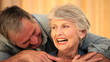 Mature couple embracing and speaking to each other