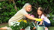 Woman and daughter doing some gardening