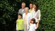 Three generations posing for a picture 