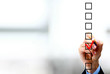 Hand choosing one of three options